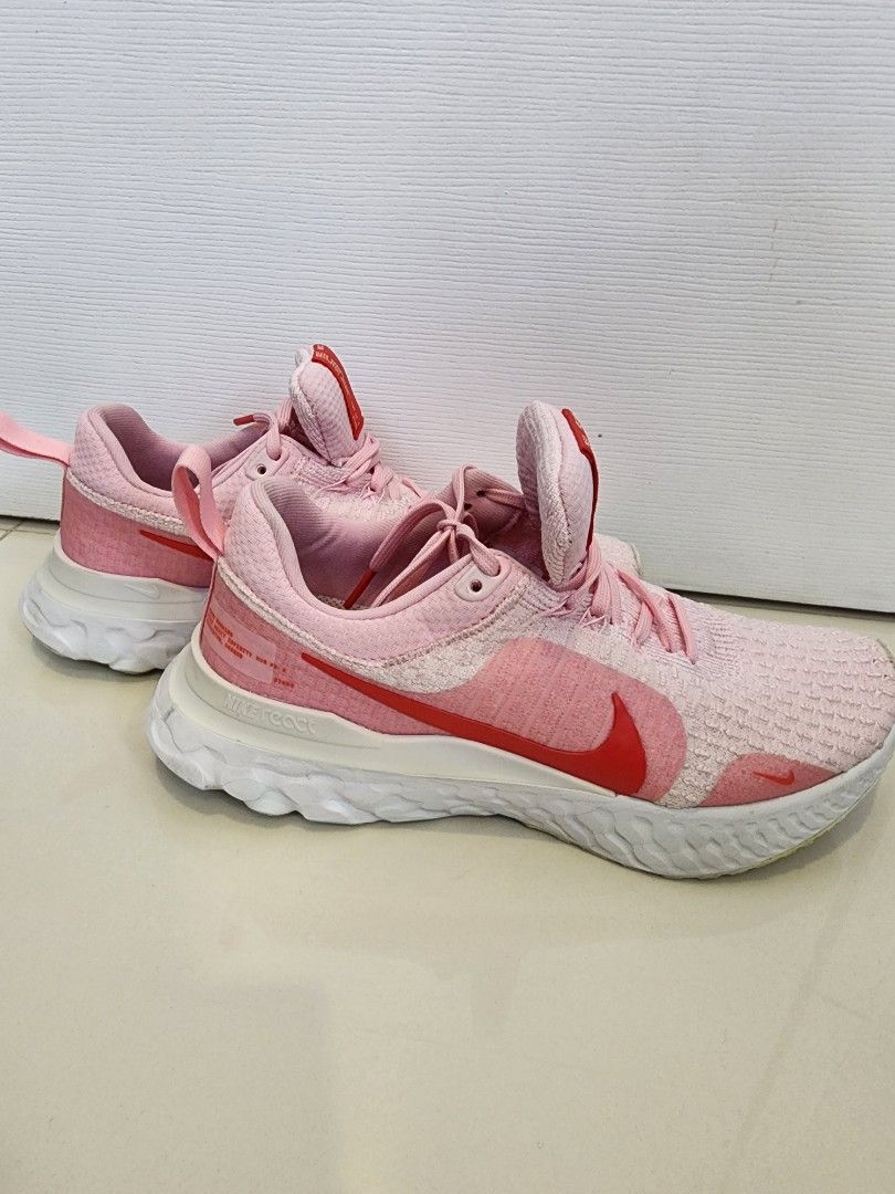 Nike Women's React Infinity Run Flyknit 3 Size 7.5 (Category: Sneakers) located in Quezon City. Submitted by pinkyshang (Listing ID 1464865918, Image 2). Description: - Brand/Model: Nike Women's React Infinity Run Flyknit 3 Size 7.5 - Colorway: Pink with striking Red Swoosh and Red Tongue Label - Sole: Cushioned White and Grey React foam with light wear on bottom tread - Upper: Breathable knit material with matching Pink laces and padded collar -