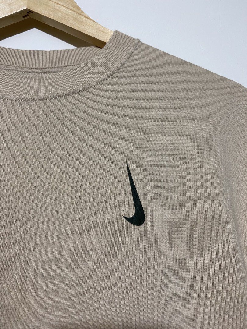 NIKE X (BILLIE EILISH), T-shirt (Category: Tshirts & Polo Shirts ) located in Cavite. Submitted by jc_thrift95 (Listing ID 1464832587, Image 3). Description: - a Nike x Billie Eilish S/S Tee in Mushroom featuring an earthy tan-brown tone and a rotated vertical Swoosh logo on the chest. - L-26.5 inch - W-19 inch - Color rate9/10 - See pictures details for dimes..