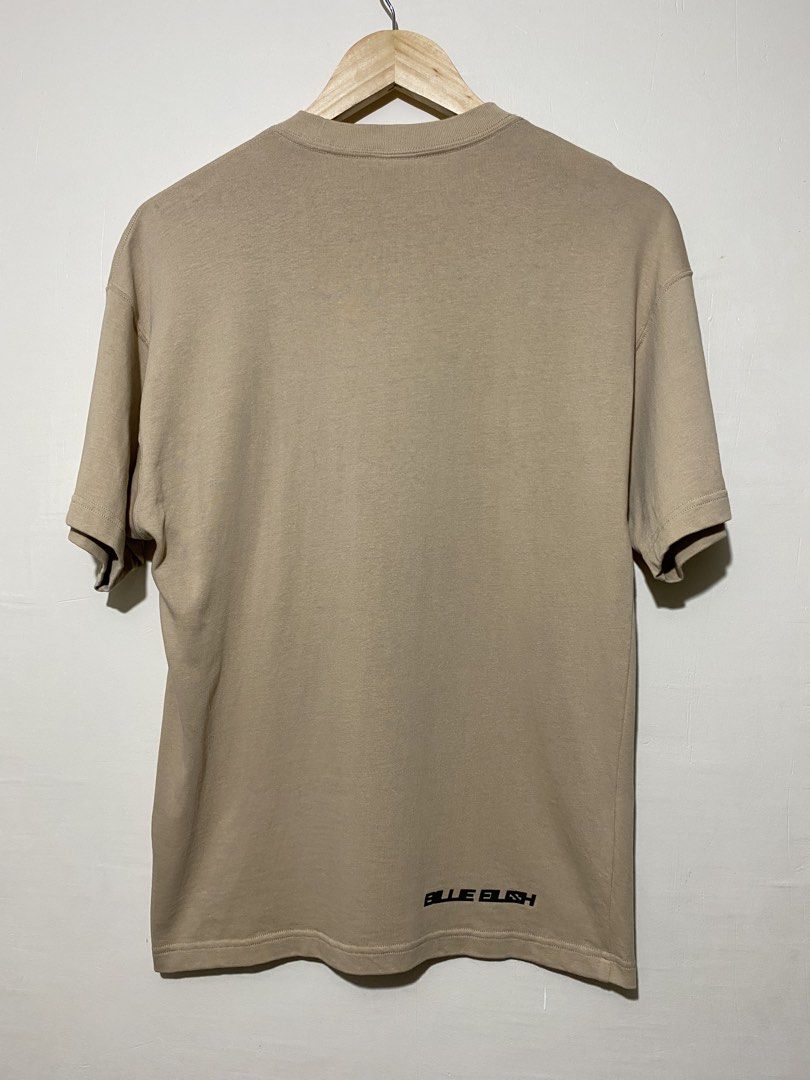 NIKE X (BILLIE EILISH), T-shirt (Category: Tshirts & Polo Shirts ) located in Cavite. Submitted by jc_thrift95 (Listing ID 1464832587, Image 2). Description: - a Nike x Billie Eilish S/S Tee in Mushroom featuring an earthy tan-brown tone and a rotated vertical Swoosh logo on the chest. - L-26.5 inch - W-19 inch - Color rate9/10 - See pictures details for dimes..