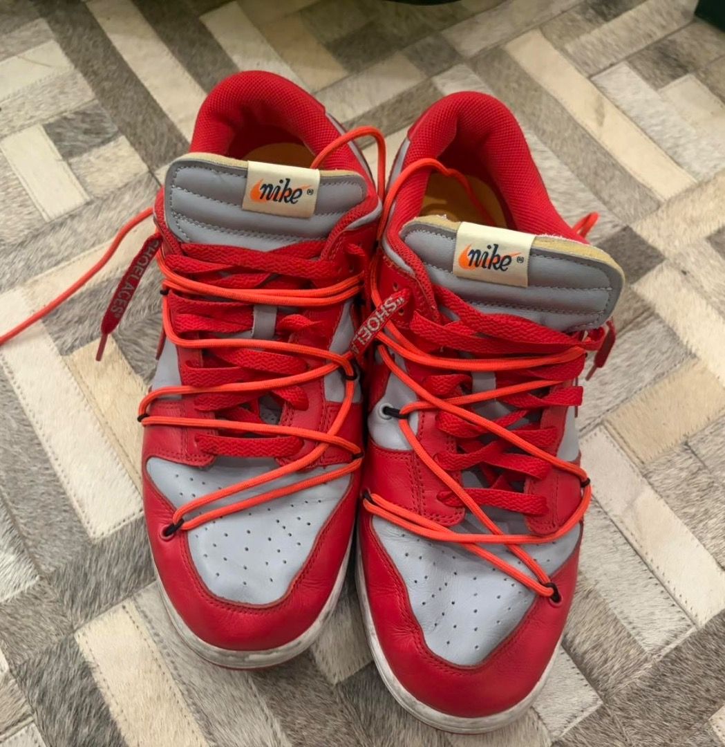 Nike x Off-White Dunk Low University Red (Category: Sneakers) located in Quezon City. Submitted by ilabluxe (Listing ID 1464917702, Image 2). Description: - Model: Off-White x Nike Dunk Low (University Red/Grey) - Size: US 10 - Condition: Ready to wear - Key Features: Secondary orange lacing system, signature zip tie, exposed foam tongue with co-branded tag, and vibrant yellow insoles - Outsole: Clean red rubber with classic pivot circles - Meet-