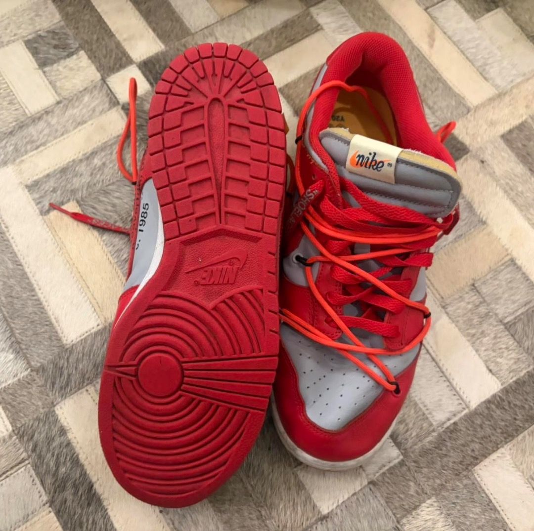 Nike x Off-White Dunk Low University Red (Category: Sneakers) located in Quezon City. Submitted by ilabluxe (Listing ID 1464917702, Image 3). Description: - Model: Off-White x Nike Dunk Low (University Red/Grey) - Size: US 10 - Condition: Ready to wear - Key Features: Secondary orange lacing system, signature zip tie, exposed foam tongue with co-branded tag, and vibrant yellow insoles - Outsole: Clean red rubber with classic pivot circles - Meet-