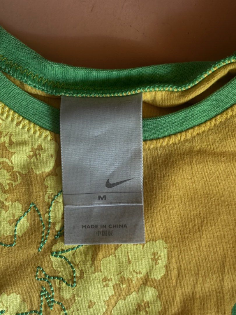 NIKE yellow embroidery top (Category: Shirts) located in Manila. Submitted by iluvbrb (Listing ID 1464806168, Image 2). Description: Medium on tag Can fit small - medium.