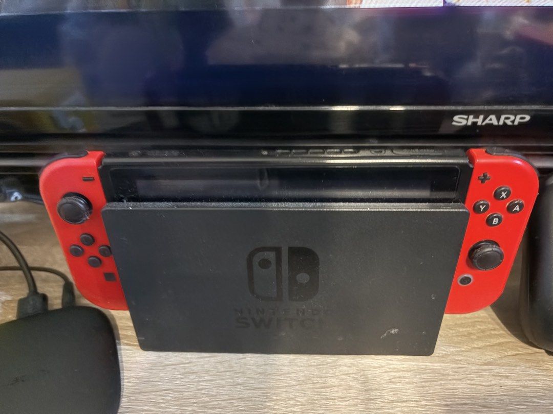 Nintendo Switch V1 (Category: Nintendo) located in Makati City. Submitted by sm0302 (Listing ID 1464830245, Image 1). Description: - Nintendo Switch console in great working condition - Includes standard black dock and matching red Joy-Con controllers - Fully functional for handheld and TV gaming modes - Minor surface dust from living room TV setup - Ready to play straight out of the box Negotiable for sure buyers.