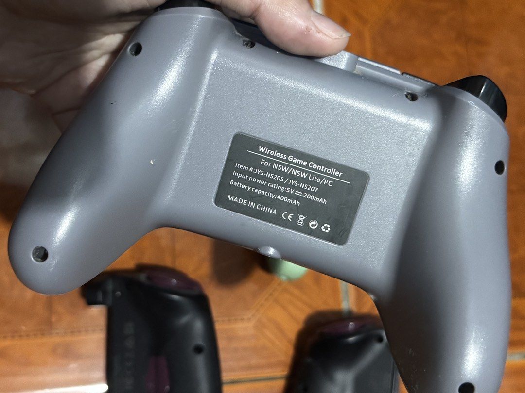 Nintendo Switch Wireless Game Controllers and Hori Grip Set (Category: Controllers) located in Pasig City. Submitted by sdpii (Listing ID 1464786985, Image 3). Description: - Complete 4-controller bundle for Nintendo Switch and PC gaming - Includes grey JYS wireless controller, white wireless controller with green silicone grips, and two Hori Monster Hunter Rise split controllers with custom thumb grips - All units tested and 100% fully functiona