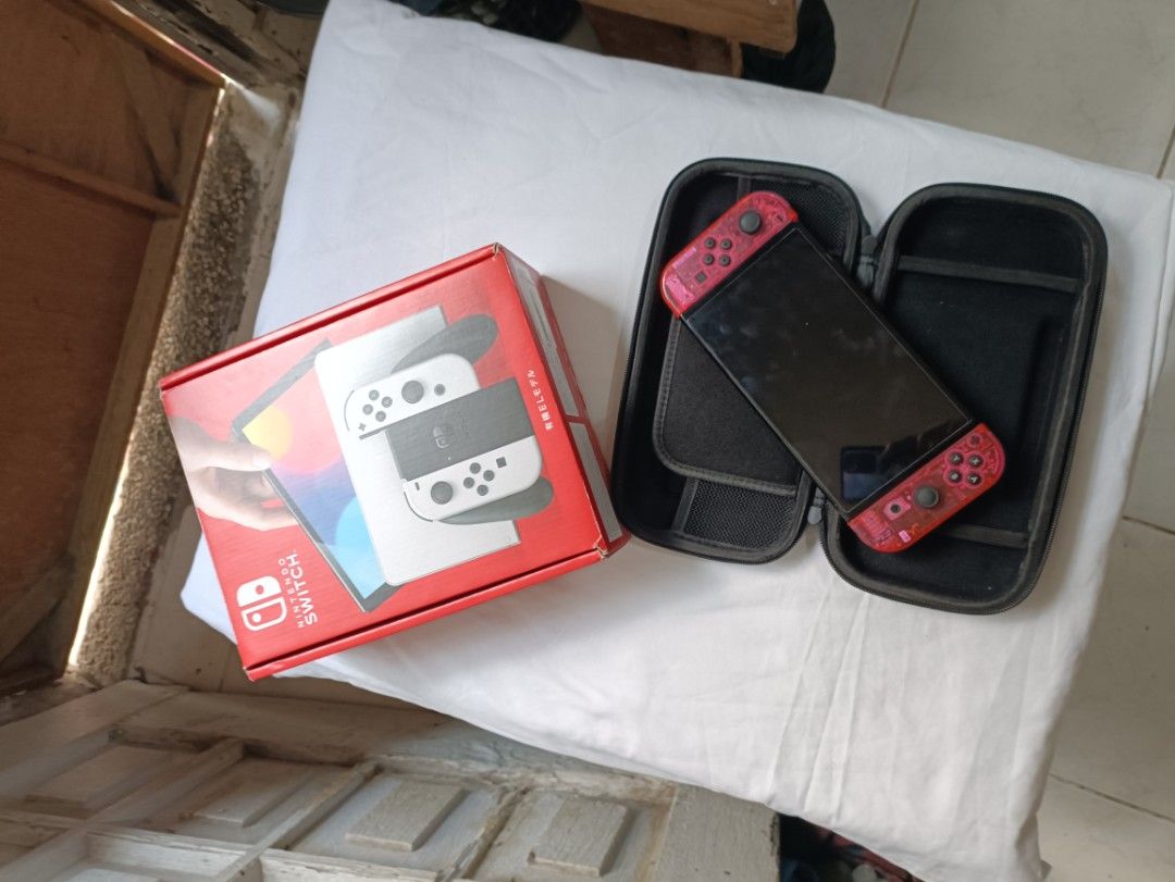 NS OLED (Category: Other Gadgets) located in Paranaque City. Submitted by jm-11 (Listing ID 1464838056, Image 2). Description: COMPLETE INCLUSION WITH BOX FREEBIES CASE POUCH ORIGINAL JOY CON SHELL STILL A ORIGINAL JOY CON SLIGHTLY NEGO‼️‼️.