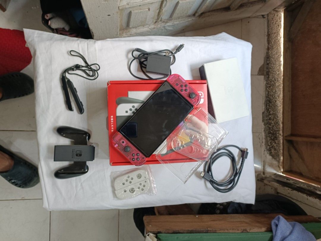 NS OLED (Category: Other Gadgets) located in Paranaque City. Submitted by jm-11 (Listing ID 1464838056, Image 1). Description: COMPLETE INCLUSION WITH BOX FREEBIES CASE POUCH ORIGINAL JOY CON SHELL STILL A ORIGINAL JOY CON SLIGHTLY NEGO‼️‼️.