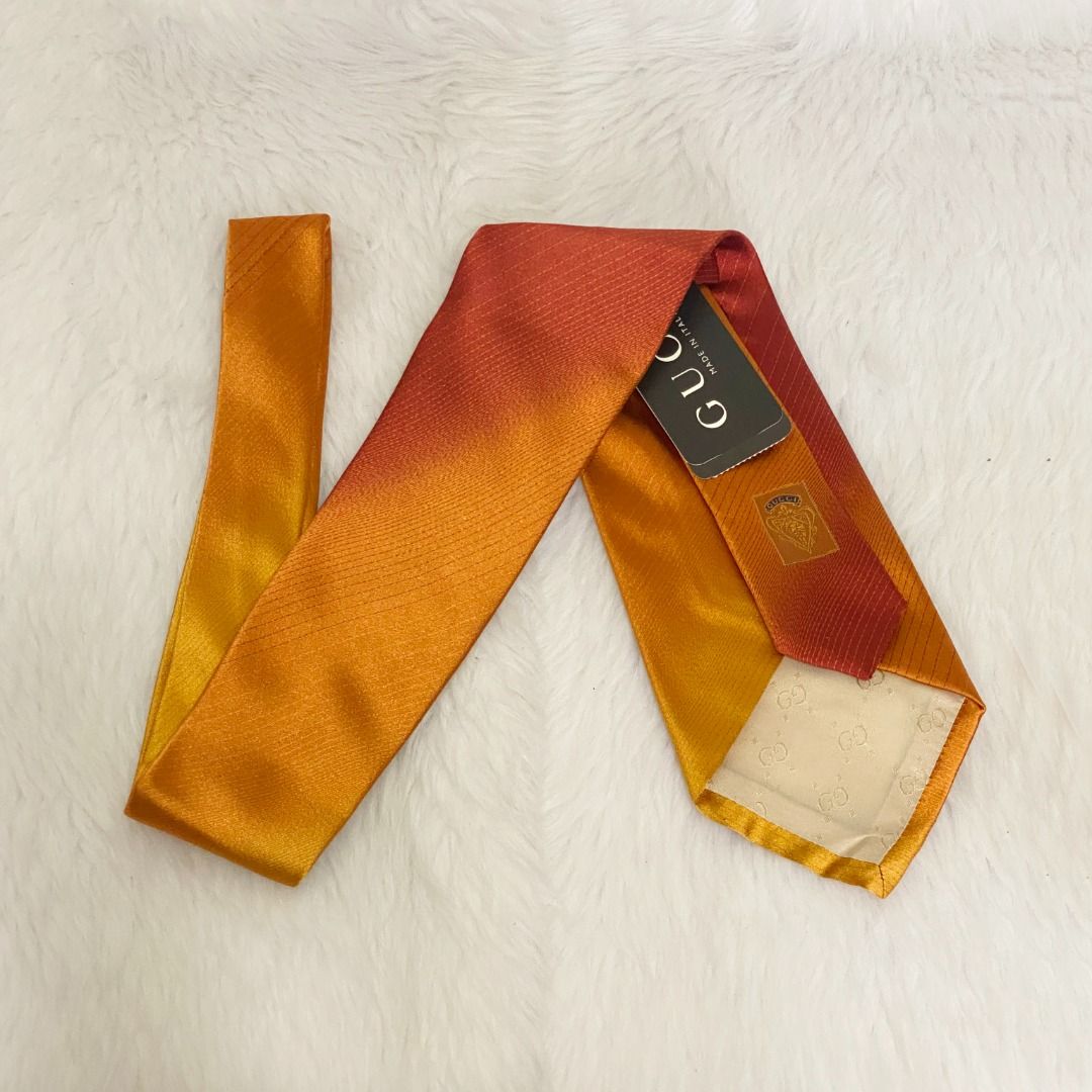 NWT Gucci Orange Red Gradient Silk Tie Necktie (Category: Ties) located in Cebu City. Submitted by posh_avenue888 (Listing ID 1464883072, Image 1). Description: Brand new. From Japan. 100% silk. Made in Italy. 3.75 inches. 100% authentic!!!.