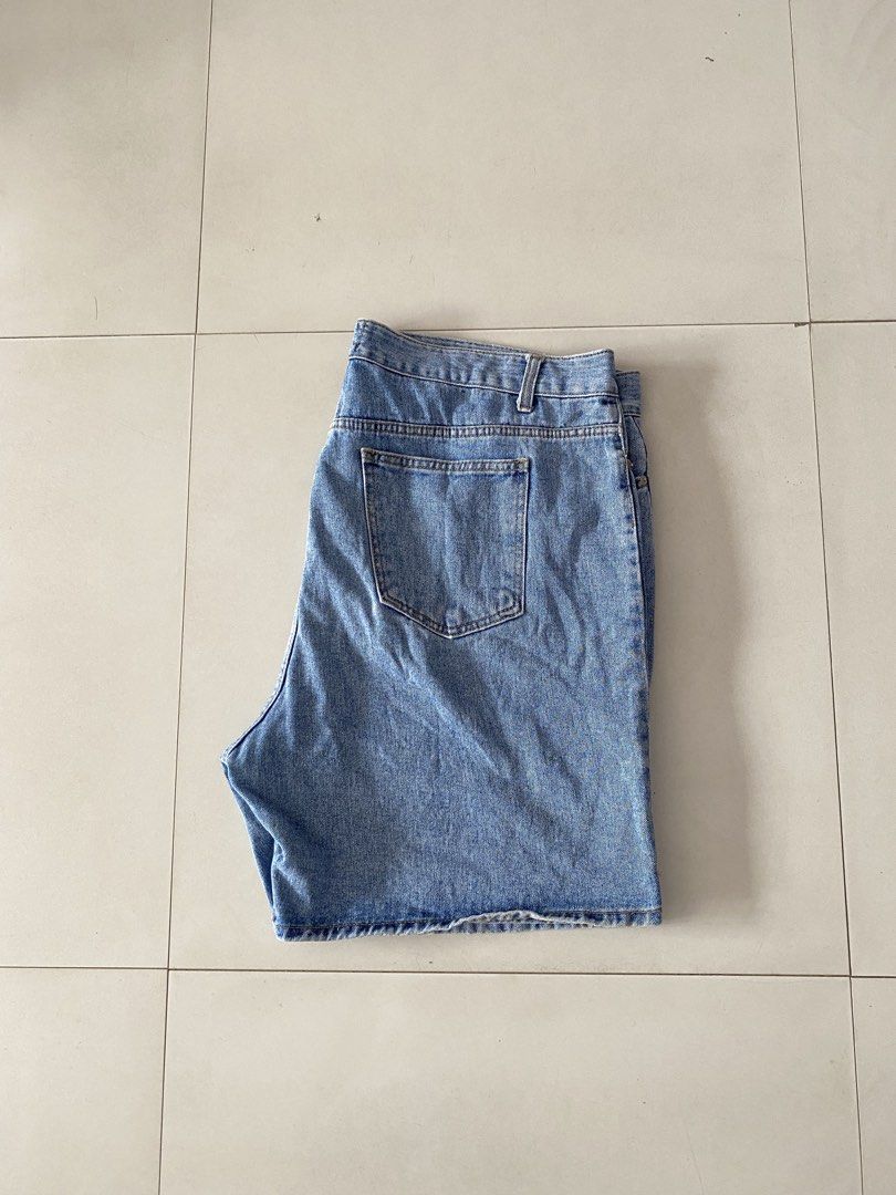 Okkane Blue Denim Shorts (Category: Shorts) located in San Carlos City. Submitted by soy_closet20s. (Listing ID 1464887627, Image 2). Description: - Brand: Okkane - Item: Blue denim shorts - Wash: Classic mid-wash finish - Features: Standard front and back pockets, belt loops, button and zipper fly closure - Style: Casual everyday staple, easy to pair with tees or hoodies - Note: Measurements available upon request.