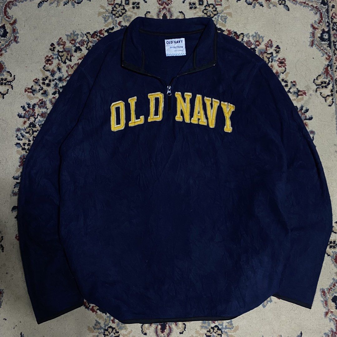 Old Navy Blue Quarter Zip Fleece Pullover Sweatshirt (Category: Coats, Jackets and Outerwear) located in Manila. Submitted by thrifturfit_star (Listing ID 1464939738, Image 1). Description: - Brand: Old Navy - Style: Quarter-zip fleece pullover - Size: XXL - Color: Dark blue with yellow embroidered chest lettering - Details: Black trim on cuffs and hem - Condition/Fit: Warm material with a comfortable, casual everyday fit.