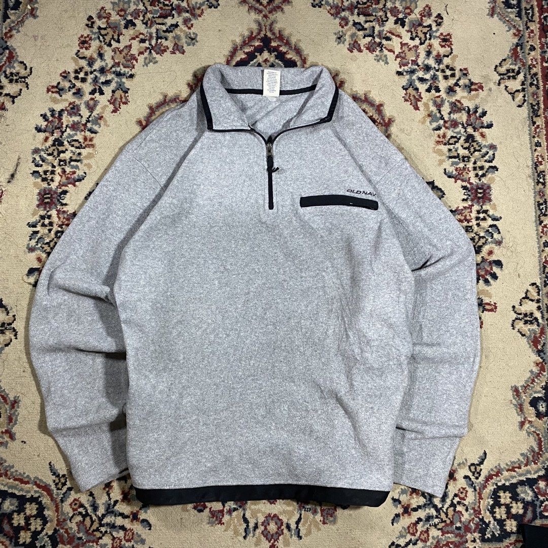 Old Navy Grey Fleece 1/4 Zip Pullover (Category: Coats, Jackets and Outerwear) located in Manila. Submitted by thrifturfit_star (Listing ID 1464938720, Image 1). Description: - Brand: Old Navy - Style: Grey fleece 1/4 zip pullover - Details: Black trim on collar, hem, and chest pocket zipper with small logo - Fit: Relaxed fit with long sleeves - Material: Warm, cozy fleece - Condition: Excellent / Great for cooler weather.