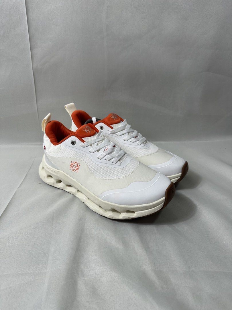 On Cloud x Loewe Cloudtilt 2 Sneakers (Category: Casual Shoes) located in Cabanglasan. Submitted by thefashiongarage.co (Listing ID 1464780775, Image 1). Description: Title - On Cloud x Loewe Model/Name - Cloudtilt 2 Size on Tag - 11USM Conditiion - Excellent Condition with no heel drag - Minimal Stain only - Washable Dimension (WxLxH) - Category- Running/Casual Fitting - Trye to size Made in - Vietnam Material - Color - White with Orange colorwa