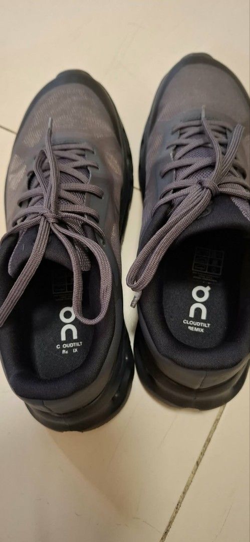 On Cloudtilt Remix Charcoal Black Sneakers (Category: Sneakers) located in Pasig City. Submitted by fryxz (Listing ID 1464881421, Image 1). Description: - Brand/Model: On Cloudtilt Remix - Color: Dark Charcoal Black - Upper: Breathable mesh with durable synthetic overlays - Sole: Distinctive hollowed-out design for superior cushioning - Closure: Standard lace-up - Outsole: Treaded for reliable daily traction - Ideal for: Lightweight running, walk