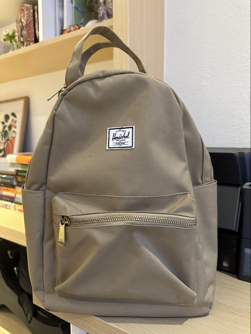 ORIGINAL Herschel Supply Co. Backpack - Olive Green (Category: Backpacks) located in Quezon City. Submitted by mars_f (Listing ID 1464859719, Image 1). Description: Color may appear different due to indoor lighting. Only used twice! Still sturdy and bought from a different country. - Classic Design - Front zip pocket - Spacious main compartment with pocket inside - Side pockets - Signature red and white stripe lining - Adjustable shoulder straps.