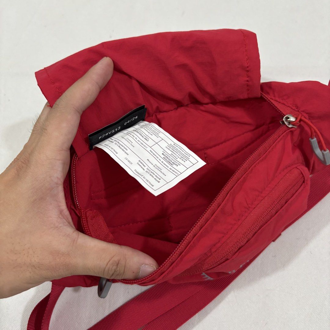 Osprey Red Waist Pack Bum Bag (Category: Belt bags, Clutches and Pouches) located in Cavite. Submitted by itsayaaa (Listing ID 1464836886, Image 3). Description: - Brand: Osprey - Color: Bright red with grey pull loops - Material: Durable and lightweight nylon - Compartments: Handy front zippered pocket and wide-opening main compartment - Fit: Adjustable strap with secure black plastic buckle - Use: Practical everyday carry for keys, phone, and w