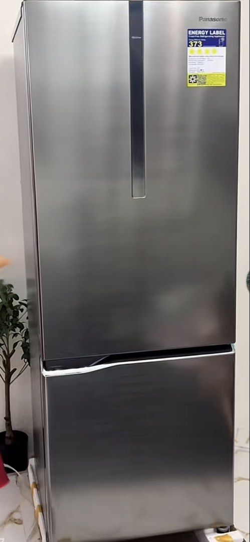 Panasonic Double Door Refrigerator (Category: Refrigerators and Freezers) located in Las Pinas. Submitted by goddhez (Listing ID 1464917499, Image 1). Description: - Brand: Panasonic - Type: Double door fridge with bottom freezer - Color: Sleek metallic silver - Energy Rating: 373 - Condition: Clean white interior, clear glass shelves, and all parts secured with blue tape - Availability: Ready for pickup Selling for a friend. Brand new Panasonic 