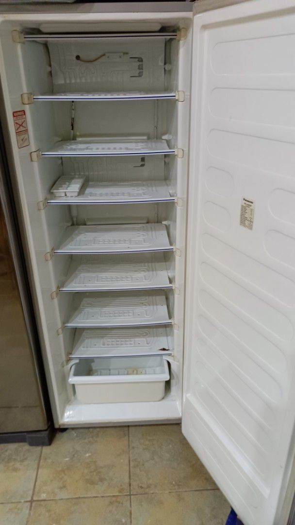 Panasonic NR-A809F Upright Freezer (Category: Refrigerators and Freezers) located in San Juan City. Submitted by pinkdenxel (Listing ID 1464900040, Image 2). Description: - Model: Panasonic NR-A809F Single Door Vertical Freezer - Color: Silver exterior with a clean white interior - Capacity: Spacious 213 liters storage volume - Power: 230V, 60Hz, 170W - Weight: 49 kg - Features: Multiple built-in cooling shelves and a convenient bottom storage bi