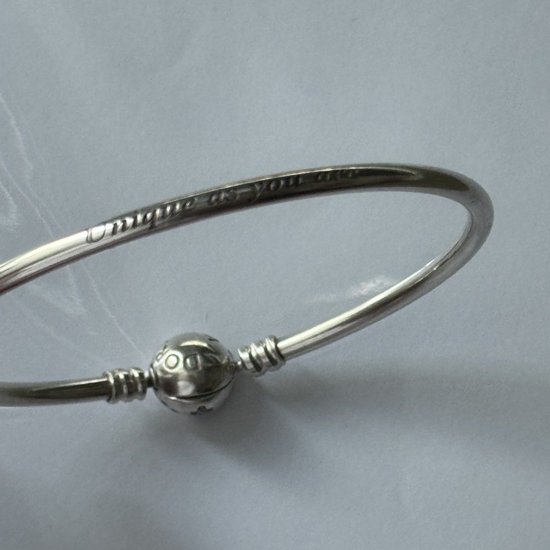 Pandora Moments Snowflake Clasp Bangle Limited Edition (Category: Bracelets) located in Quezon City. Submitted by thingsforless (Listing ID 1464903703, Image 3). Description: Authentic Pandora silver bangle bracelet. Bought from USA. Newly cleaned and polished by Pandora Shangrila Plaza Pandora Size 19cm ( Fits wrist size 17cm - 18 cm : see last posted photo for actual details from Pandora) Round clasp features pavé set stones forming a snowflake