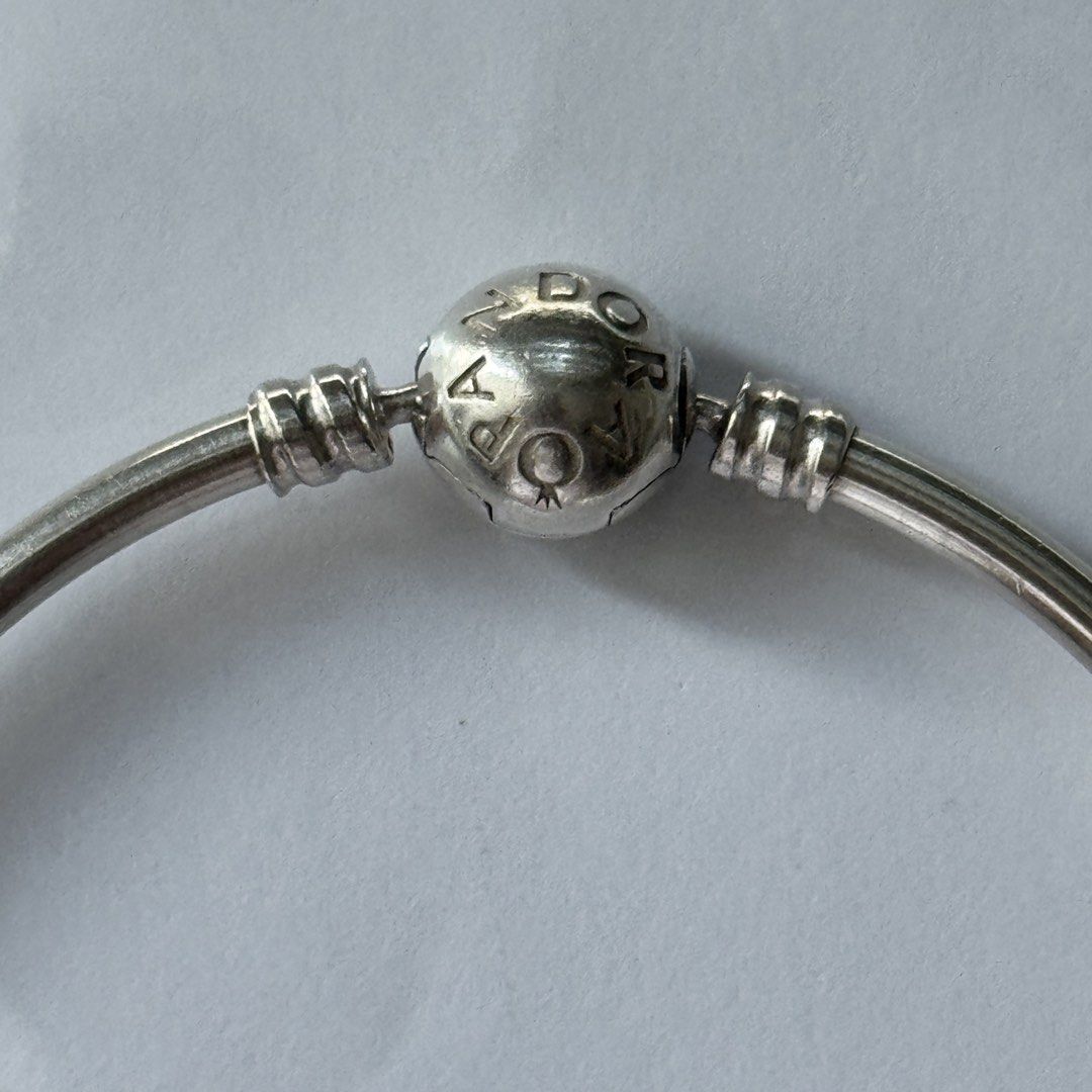 Pandora Moments Snowflake Clasp Bangle Limited Edition (Category: Bracelets) located in Quezon City. Submitted by thingsforless (Listing ID 1464903703, Image 2). Description: Authentic Pandora silver bangle bracelet. Bought from USA. Newly cleaned and polished by Pandora Shangrila Plaza Pandora Size 19cm ( Fits wrist size 17cm - 18 cm : see last posted photo for actual details from Pandora) Round clasp features pavé set stones forming a snowflake