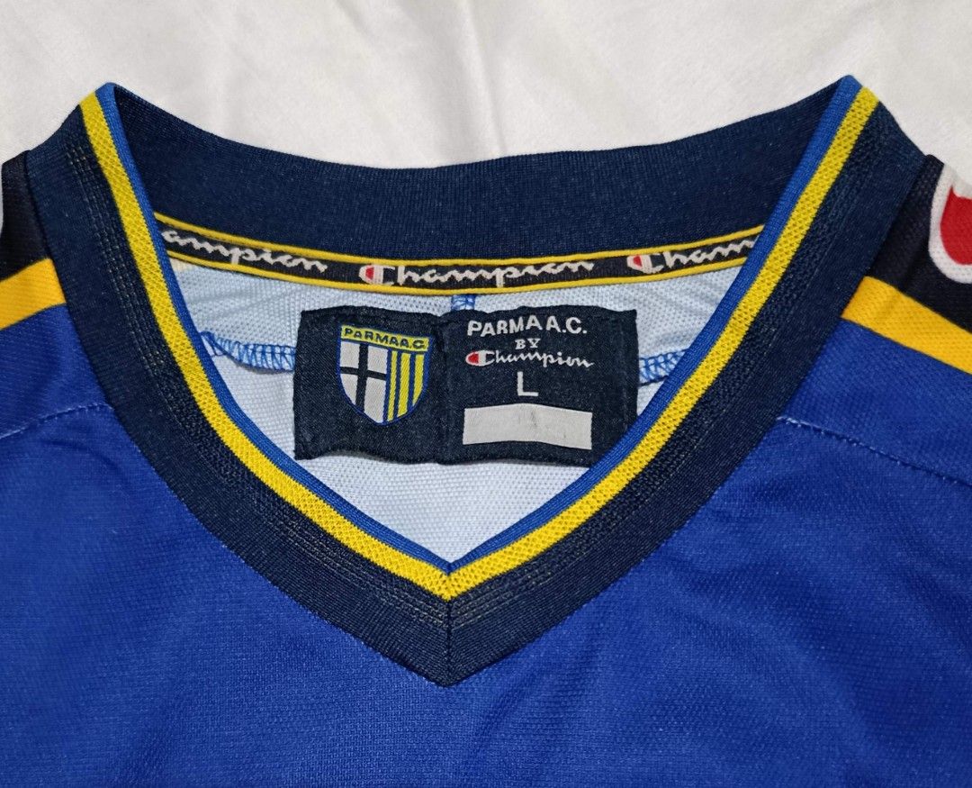 Parma AC Football Jersey L (Category: Activewear) located in Marikina City. Submitted by hals1995 (Listing ID 1464769178, Image 3). Description: - Authentic vintage Parma AC home football shirt by Champion - made in Italy - Coppa Italia winner - Classic blue and yellow hoops design - Joy sponsor, Champion logo and Parma crest in felt - V-neck collar with black, yellow, blue trim - Size: L chest 22" - EUC - shipped.