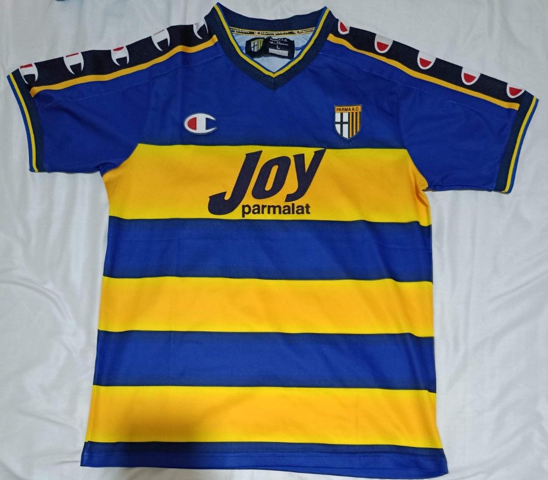 Parma AC Football Jersey L (Category: Activewear) located in Marikina City. Submitted by hals1995 (Listing ID 1464769178, Image 2). Description: - Authentic vintage Parma AC home football shirt by Champion - made in Italy - Coppa Italia winner - Classic blue and yellow hoops design - Joy sponsor, Champion logo and Parma crest in felt - V-neck collar with black, yellow, blue trim - Size: L chest 22" - EUC - shipped.