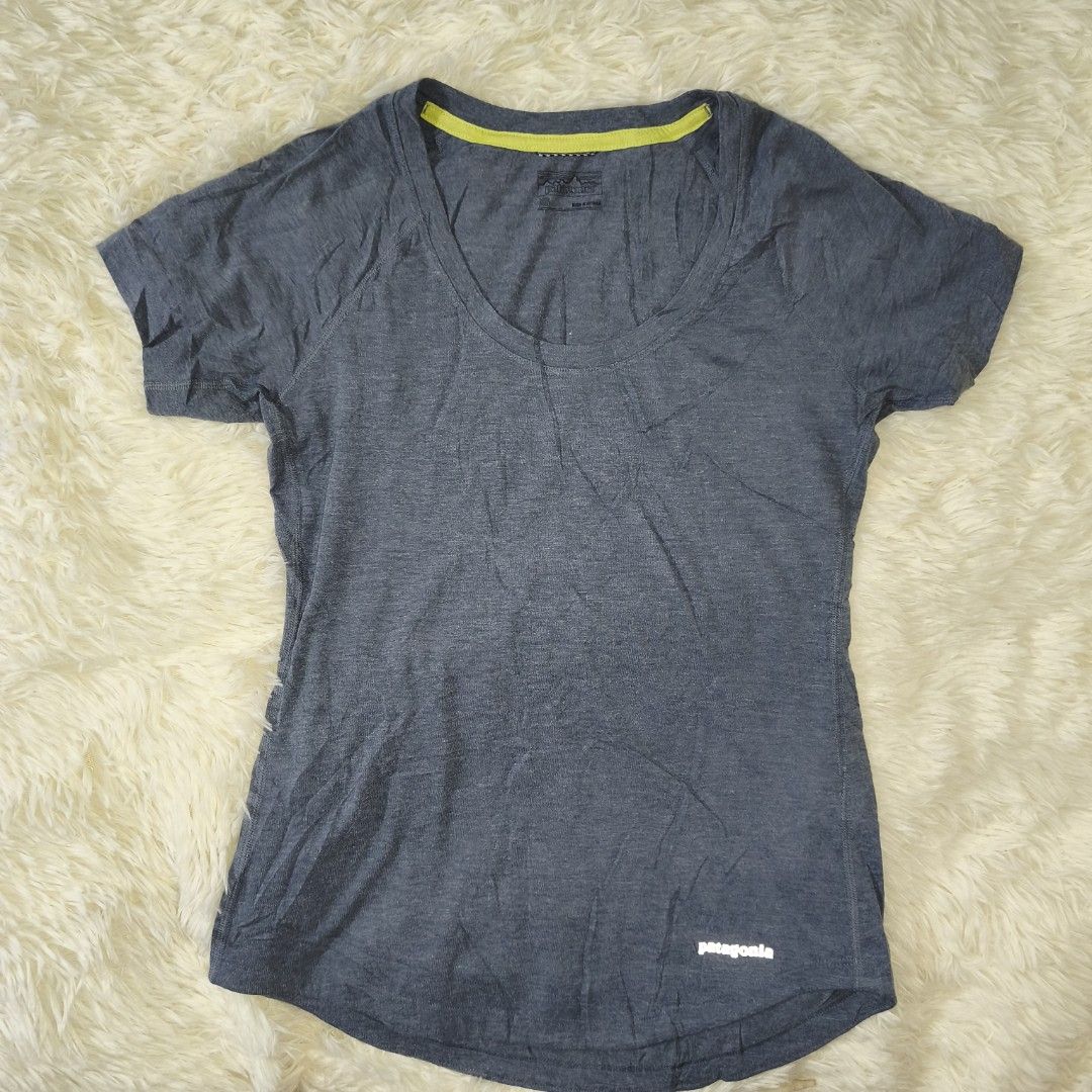 Patagonia Women's (Category: Shirts) located in Antipolo. Submitted by alphaomega_fox (Listing ID 1464890294, Image 1). Description: - Brand: Patagonia - Style: Athletic t-shirt with scoop neck - Color: Heather blue with lime green inner collar trim - Size: XS 17x25 - Material: 100% polyester - Details: Small white Patagonia logo near front hem, Worn Wear tag inside - Condition: excellent condition 250 plus sf.