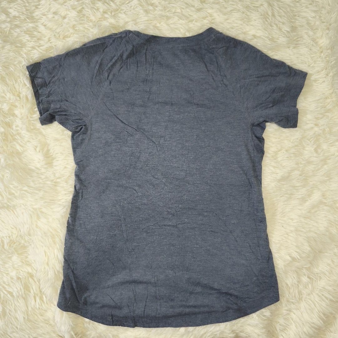 Patagonia Women's (Category: Shirts) located in Antipolo. Submitted by alphaomega_fox (Listing ID 1464890294, Image 2). Description: - Brand: Patagonia - Style: Athletic t-shirt with scoop neck - Color: Heather blue with lime green inner collar trim - Size: XS 17x25 - Material: 100% polyester - Details: Small white Patagonia logo near front hem, Worn Wear tag inside - Condition: excellent condition 250 plus sf.