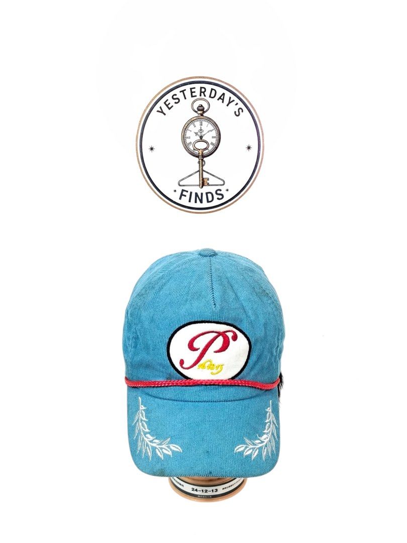 Peace minus one cap (Category: Caps & Hats) located in Manila. Submitted by yesterdaysfinds (Listing ID 1464864337, Image 1). Description: - Color & Material: Light blue textured corduroy - Front Design: White embroidered leaf details and a circular red-lettered patch - Brim Detail: Stylish red braided cord across the brim - Back Detail: Cute embroidered white and yellow daisy - Fit: Adjustable back strap with a black band and metal clasp - Style