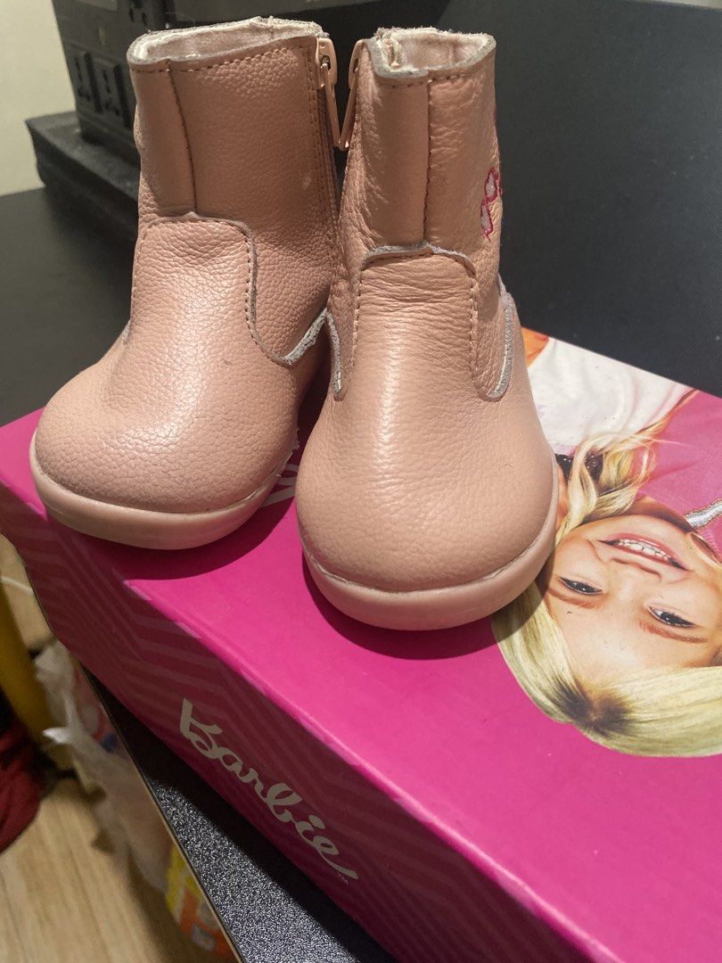 Pebbles Pink Boots Size 5 (Category: Babies & Kids Fashion) located in Manila. Submitted by chingsenallertse (Listing ID 1464894344, Image 1). Description: - Brand: Pebbles - Size: 5 - Material: Pink leather style - Closure: Side zipper for easy wear - Design: Embroidered Barbie logo and heart graphics - Comfort: Soft lining inside - Condition: Brand new / Excellent.