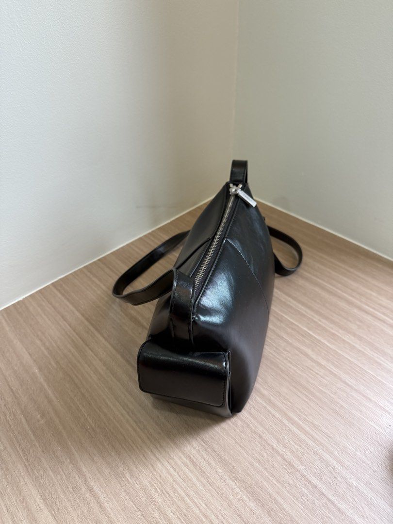 Pedro Black Shoulder Bag with Side Pockets (Category: Shoulder Bags) located in Manila. Submitted by elisesnts (Listing ID 1464838822, Image 2). Description: - Brand: Pedro - Material: Black leather-look finish - Hardware: Silver-tone with engraved pull tag - Closure: Secure main zipper - Pockets: 2 exterior side pockets with magnetic snap flaps - Condition: Clean inside and out.