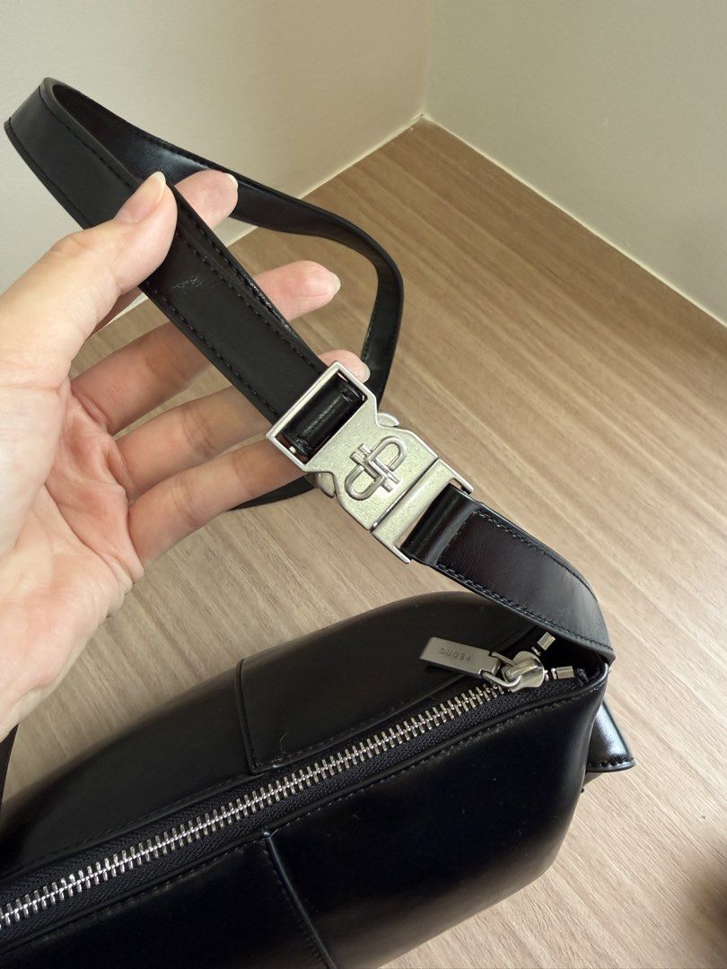 Pedro Black Shoulder Bag with Side Pockets (Category: Shoulder Bags) located in Manila. Submitted by elisesnts (Listing ID 1464838822, Image 3). Description: - Brand: Pedro - Material: Black leather-look finish - Hardware: Silver-tone with engraved pull tag - Closure: Secure main zipper - Pockets: 2 exterior side pockets with magnetic snap flaps - Condition: Clean inside and out.