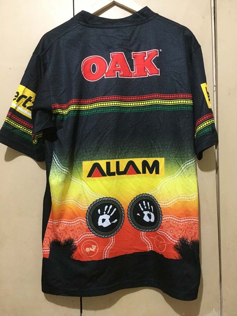 Penrith Panthers NRL Indigenous Jersey OAK PLUS (Category: Activewear) located in Davao. Submitted by jepjep23_03 (Listing ID 1464882347, Image 2). Description: - Authentic Penrith Panthers Oils collection jersey - Sleek black design with striking indigenous dot art in yellow, red, and green gradients - Features OAK PLUS chest sponsor, plus Hertz, Bluestone, and Allam sleeve and back branding - Traditional rugby league collar and short sleeves - 
