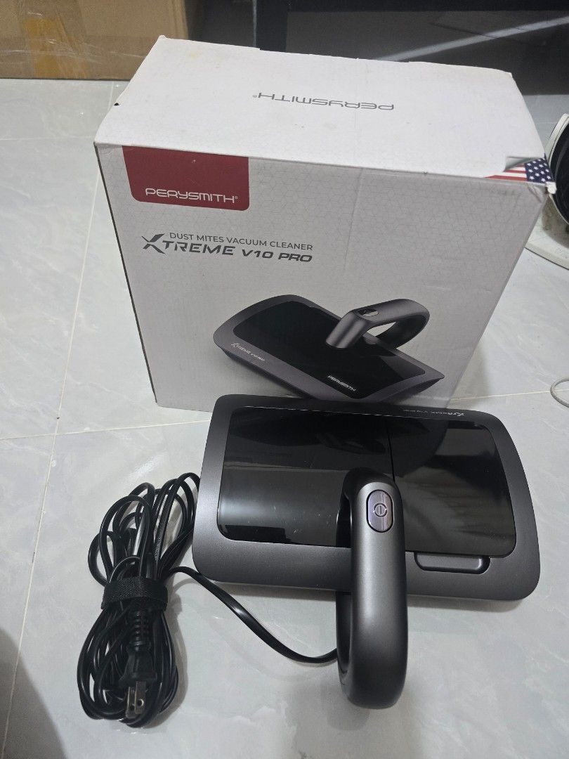 PerySmith Xtreme V10 Pro Dust Mites Vacuum Cleaner (Category: Vacuum Cleaner & Housekeeping) located in Manila. Submitted by justliber27074 (Listing ID 1464955775, Image 1). Description: - Model: PerySmith Xtreme V10 Pro Dust Mites Vacuum Cleaner - Color: Dark gray body with sleek black glossy compartments - Usage: Ideal for deep cleaning beds, sofas, and all kinds of upholstery - Power: Reliable wired model with a long black power cord included 