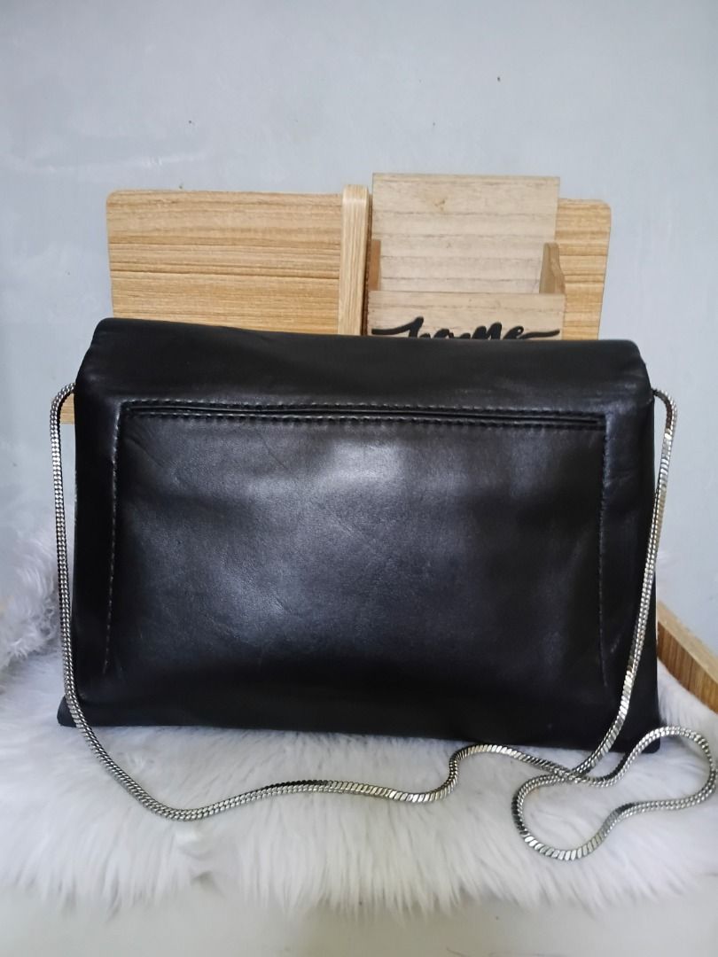 Phillip Lim Alix chain Bag (Category: Luxury Bags & Wallets) located in Lucena. Submitted by gracious_chin0436 (Listing ID 1464787120, Image 2). Description: - Style: Black leather-style shoulder bag with a trendy slouchy flap design - Hardware: Elegant silver chain strap and eye-catching silver-tone statement clasp - Storage: Handy slip pocket on the back for quick-access items - Condition: Clean interior and exterior, excellent and ready-to-use