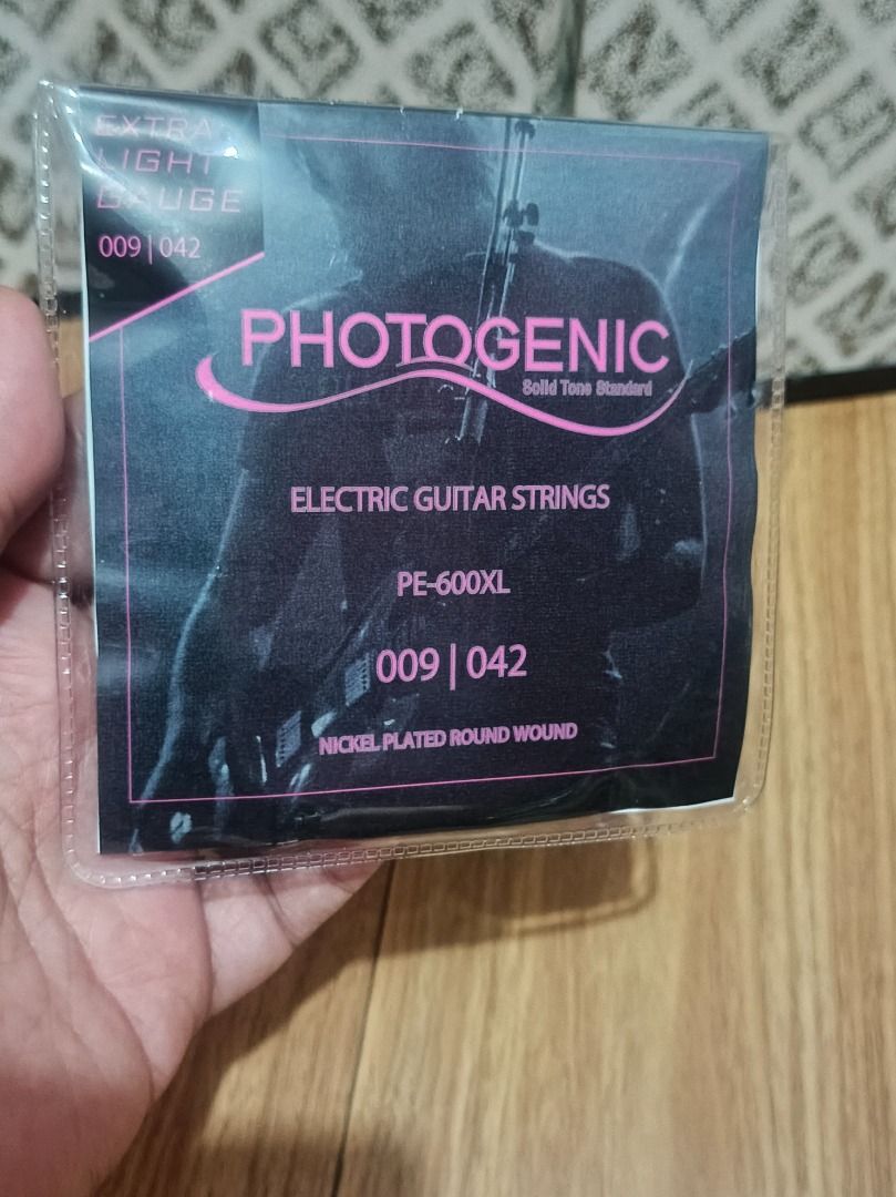 Photogenic Electric Guitar Strings (Category: Musical Instruments) located in Makati City. Submitted by nyxhemera26 (Listing ID 1464874019, Image 1). Description: Photogenic Electric Guitar Strings - Brand: Photogenic - Model: PE-600XL - Gauge: Extra Light (009 - 042) - Material: Nickel plated round wound with plain steel high strings - Condition: Brand new in original packaging - Perfect for standard setups and smooth playability.