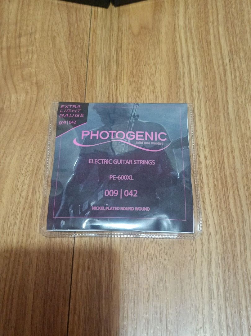 Photogenic Electric Guitar Strings (Category: Musical Instruments) located in Makati City. Submitted by nyxhemera26 (Listing ID 1464874019, Image 2). Description: Photogenic Electric Guitar Strings - Brand: Photogenic - Model: PE-600XL - Gauge: Extra Light (009 - 042) - Material: Nickel plated round wound with plain steel high strings - Condition: Brand new in original packaging - Perfect for standard setups and smooth playability.