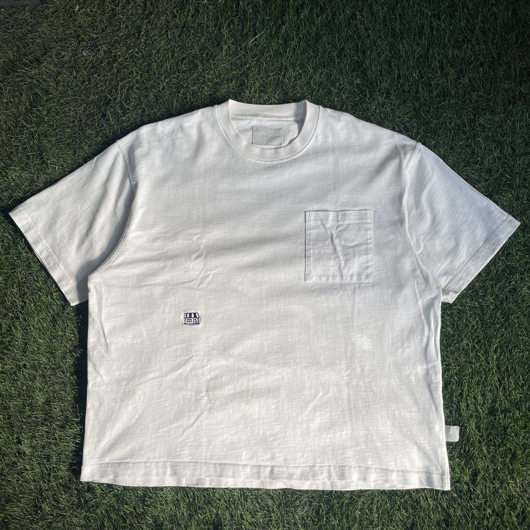 Pin SkTBS Pocket Tee (Category: Tshirts & Polo Shirts ) located in Pasig City. Submitted by icie_finds (Listing ID 1464877996, Image 1). Description: Pin SkTBS Pocket Tee SIZE: Fits Large (Tagged L) DIMES: Width: 27 inches Length: 28 inches Model: Pin SkTBS Casual Pocket T-Shirt Style: Relaxed fit short-sleeve tee featuring a classic crewneck collar, single left chest pocket, textured slub cotton fabric, and a small embroidered storefront graphic