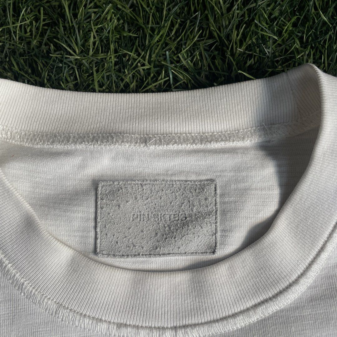 Pin SkTBS Pocket Tee (Category: Tshirts & Polo Shirts ) located in Pasig City. Submitted by icie_finds (Listing ID 1464877996, Image 3). Description: Pin SkTBS Pocket Tee SIZE: Fits Large (Tagged L) DIMES: Width: 27 inches Length: 28 inches Model: Pin SkTBS Casual Pocket T-Shirt Style: Relaxed fit short-sleeve tee featuring a classic crewneck collar, single left chest pocket, textured slub cotton fabric, and a small embroidered storefront graphic