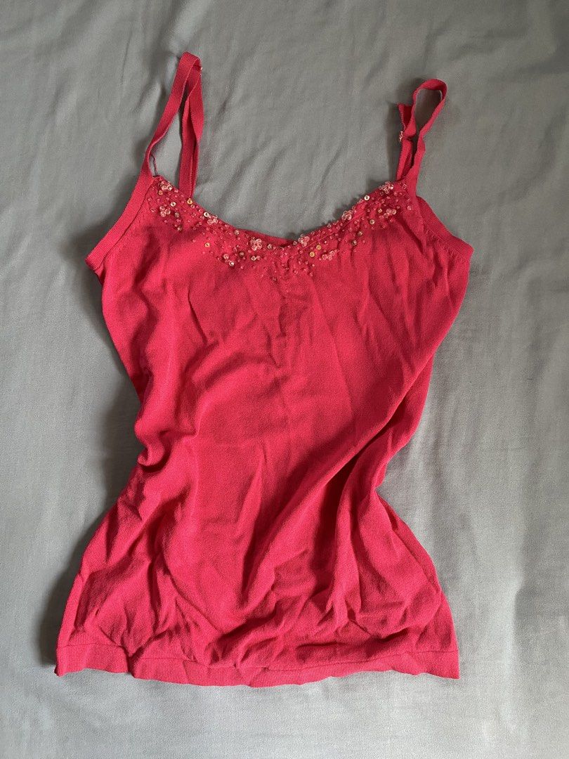 Pink Cami Tank Top with Beaded Neckline (Category: Sleeveless) located in Manila. Submitted by heyheyruok (Listing ID 1464798255, Image 1). Description: - Color: Bright pink - Material: Soft, stretchy ribbed knit - Features: Adjustable straps, sweetheart neckline with beaded and sequin flower/gold disc embellishments - Styling: Perfect to pair with high-waisted jeans or a skirt for a night out.