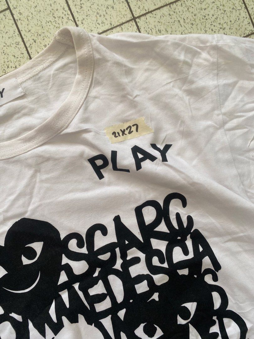 Play Comme des Garcons Graphic White Tee XL (Category: Shirts) located in Manila. Submitted by sepamorash53558 (Listing ID 1464807885, Image 2). Description: - Brand: Play Comme des Garcons - Color: White with black typography and heart graphic - Accent: Signature red heart motif - Size: XL - Material: 100% cotton - Condition: Clean and ready to wear.