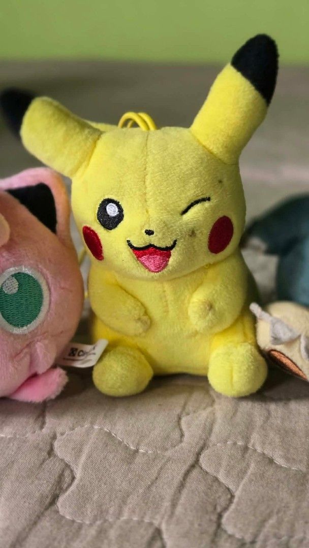Pokemon Plush Toy Set Jigglypuff Pikachu Snorlax Farfetch'd Psyduck (Category: Plushies & Soft Toys) located in Baguio. Submitted by je_ver_lyn16 (Listing ID 1464845310, Image 3). Description: - Authentic 5-piece Pokémon plush bundle - Includes: Jigglypuff (with suction cup/strap), winking Pikachu, sleeping Snorlax (with loop), Farfetch'd with leek, and Psyduck - Features various fun sizes and poses - Some plushies come with attached straps, loop