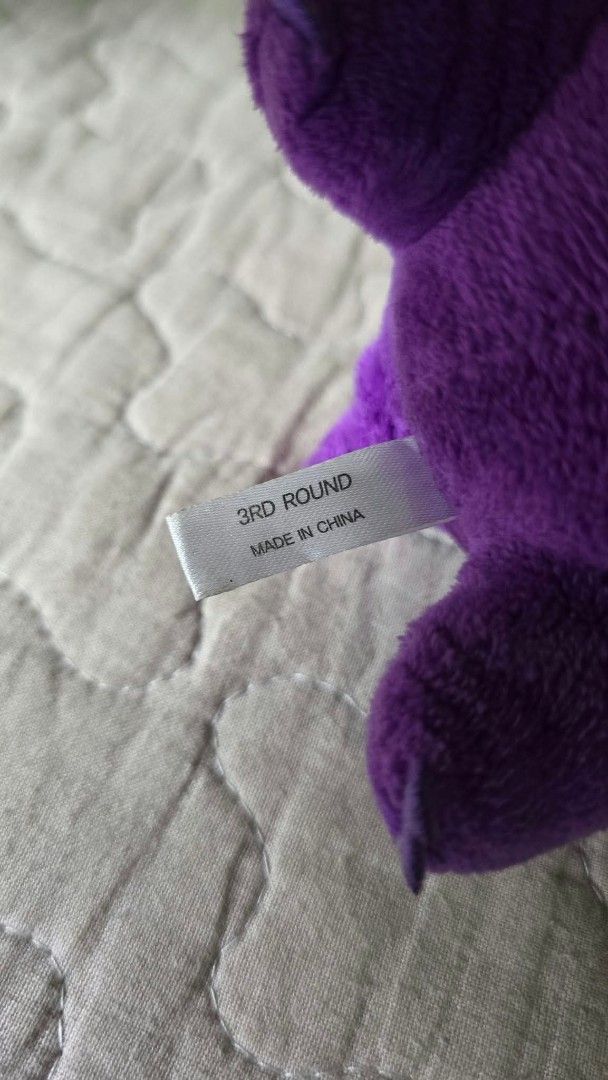 Pokémon Gengar plush keychain purple (Category: Plushies & Soft Toys) located in Baguio. Submitted by je_ver_lyn16 (Listing ID 1464843598, Image 3). Description: - Item: Gengar plush keychain 3rd round korea exclusive - Material: Soft purple fabric with embroidered red eyes and stitched white grin - Attachment: Durable purple plastic clip on the back - Authenticity/Origin: Tag reads '3rd Round Made in China' - Condition: Excellent, clean, no stai