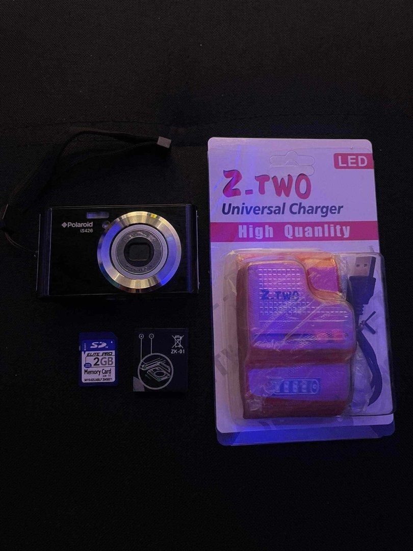 Polaroid iS426 Digital Camera (Category: Cameras) located in Manila. Submitted by prplestitch (Listing ID 1464796522, Image 1). Description: - Camera Model: Polaroid iS426 compact digital camera (Black) - Condition: Powers up and works great, ideal for retro digital photography - Included Accessories: hand strap, and packaging - Storage Included: 2GB SD Elite Pro memory card ready for use Issue: - No port cover - No battery (need to buy one) - Ov