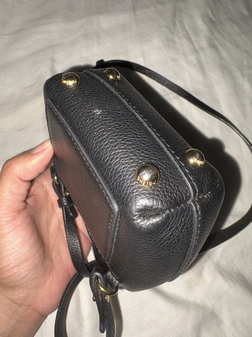 Polène Numéro Un Micro Black Leather Bag (Category: Luxury Bags & Wallets) located in Quezon City. Submitted by boombooompau11 (Listing ID 1464812459, Image 2). Description: - Brand: Polène - Model: Numéro Un Micro - Color/Material: Black grained leather with gold-tone hardware - Features: Top handle, adjustable crossbody strap, structured dome shape, front flap closure, protective bottom feet - Condition: Excellent with minor dust accumulation i