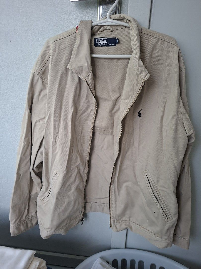 Polo by Ralph Lauren Beige Zip Jacket (Category: Coats, Jackets and Outerwear) located in Davao. Submitted by ernestojosereyes (Listing ID 1464966203, Image 1). Description: - Brand: Polo by Ralph Lauren - Color: Classic Beige - Style: Zip-up jacket with classic collar and front zipper closure - Details: Features slanted hand pockets and iconic small embroidered pony logo on the chest - Material: Lightweight fabric, ideal for layering during bree