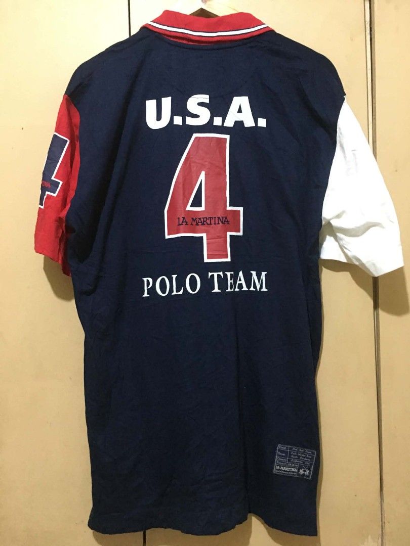 Polo La Martina (Category: Tshirts & Polo Shirts ) located in Davao. Submitted by jepjep23_03 (Listing ID 1464881452, Image 2). Description: - Color: Navy blue with red collar and red-white sleeve blocks - Design: Large number 4, 'U.S.A.' lettering, World Polo Championship 1998 Southern California patch, and American flag detail - Style: Classic button placket, bold 1998 collection graphic style - Condition: Good vintage condition - Perfect for: 