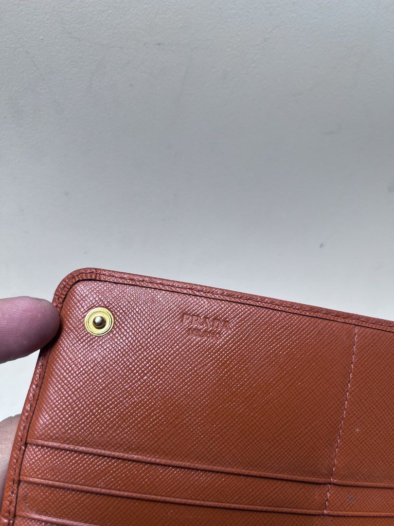 Prada (Category: Wallets & Card holders) located in Dagupan City. Submitted by calmocean-f675cc (Listing ID 1464802675, Image 3). Description: Prada Long wallet Authentic Orange 2999 add sf .