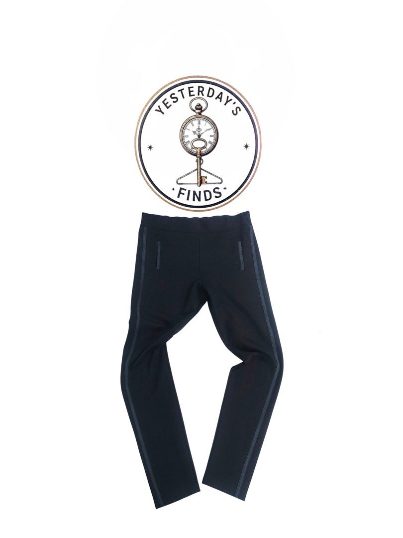 Prada Black Pants Trousers with Side Stripe (Category: Trousers) located in Manila. Submitted by yesterdaysfinds (Listing ID 1464855103, Image 1). Description: Prada Relaxfit Gym Pants Condition : Verygood Size : Large Actual 👇 Waist : 28-32 Lenght : 36 Leg Opening : 8 Insem : 27 Hem : 5 📌 - Brand: Prada - Color: Classic black with contrast side striping - Details: Faux welt pockets and signature metal logo plaque near the waistband - Fit: Clea