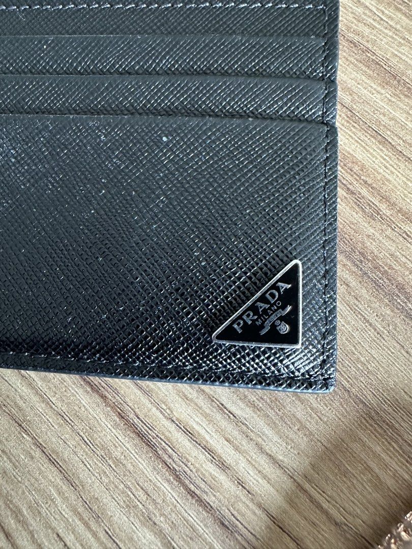 Prada cardholder saffiano leather (Category: Luxury Bags & Wallets) located in Quezon City. Submitted by nancdmd (Listing ID 1464814663, Image 2). Description: Prada saffiano leather cardholder - lightly used condition - unisex Authentic or your money back. Item is available in my shop at Panay ave QC. Like and follow on ig handbagcravingsph.