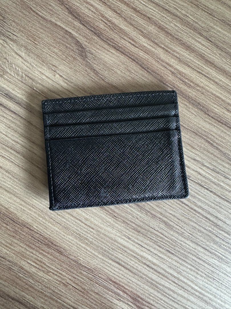 Prada cardholder saffiano leather (Category: Luxury Bags & Wallets) located in Quezon City. Submitted by nancdmd (Listing ID 1464814663, Image 3). Description: Prada saffiano leather cardholder - lightly used condition - unisex Authentic or your money back. Item is available in my shop at Panay ave QC. Like and follow on ig handbagcravingsph.