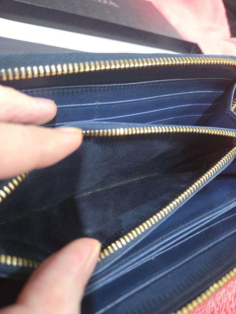 Prada long zip leather wallet (Category: Wallets & Card holders) located in Quezon City. Submitted by jen_4kids (Listing ID 1464868403, Image 3). Description: Prada long zip leather wallet Color (card) bluette Bought jan 2019 Complete inclusion (card, box, paperbag eve receipt) Used less than a year (occasionally) Condition excellent used condition to looks new.